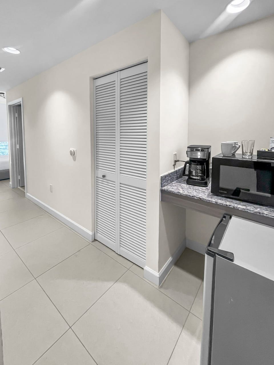 Enjoy the convenience of the kitchenette, ready for your favorite coffee or meal prep.