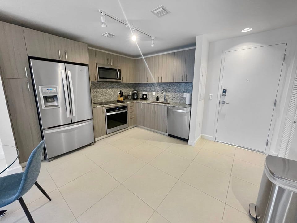 Cook up a feast in this full kitchen, boasting stainless steel appliances and ample counter space for meal prep.