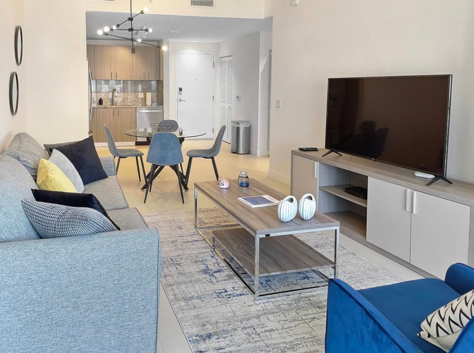 Savor your favorite shows in this inviting living room, complete with plush seating and a large Smart TV.