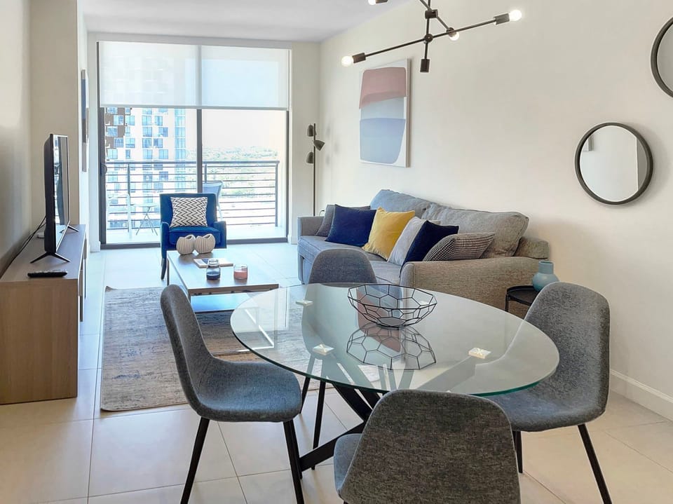 Relax in this stylish living area, featuring modern decor and cozy seating, perfect for unwinding.