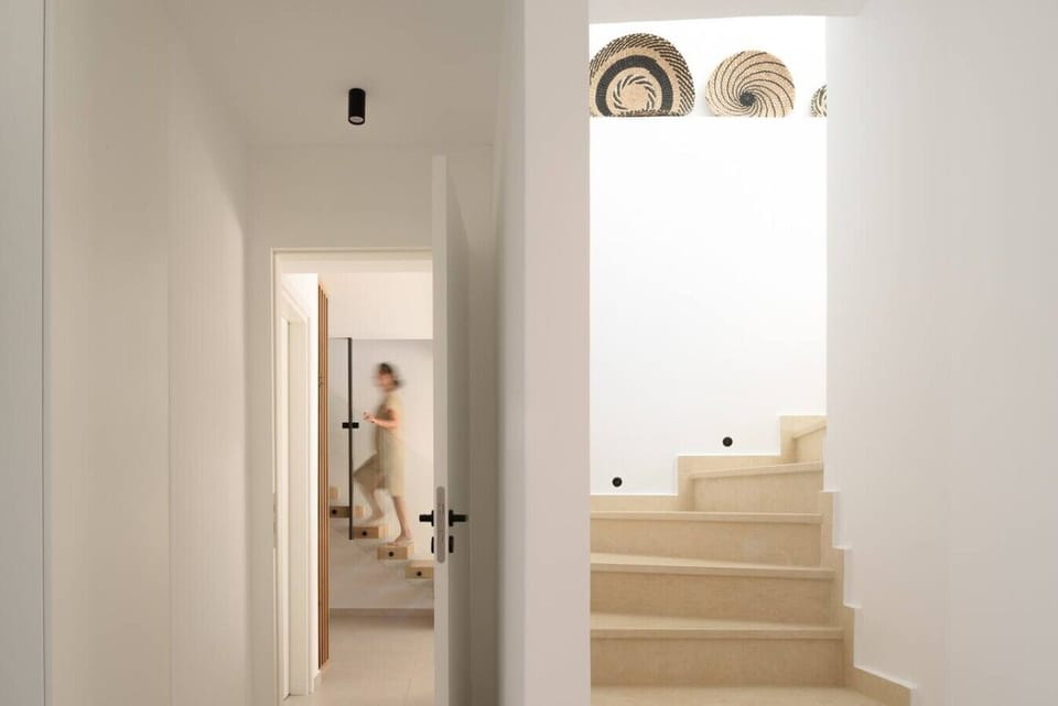 Elegant stairway leading to the first floor.