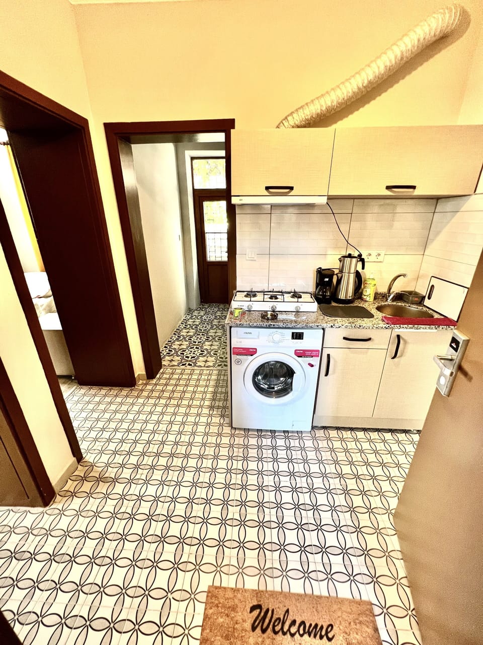 Fridge, microwave, stovetop, coffee/tea maker