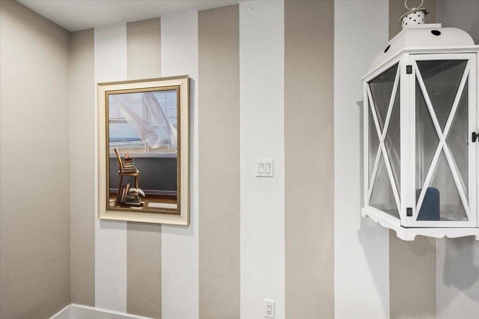 Coastal hallway décor with nautical accents and modern beach house interior design details.