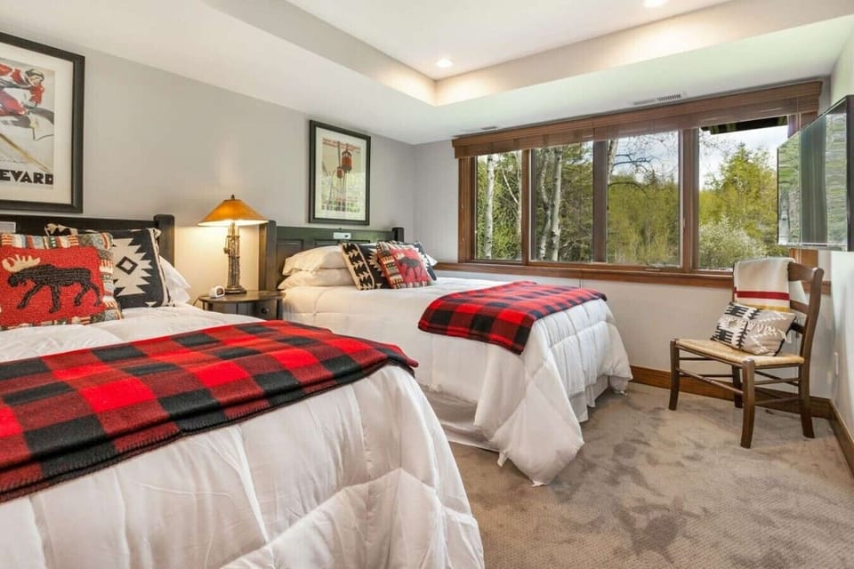 Bedroom 3: Two double beds on lower level with smart TV