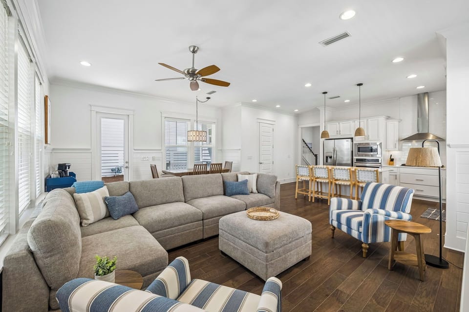 Relax in your open-concept retreat, where coastal charm meets modern comfort. Sink into the sectional, whip up meals in the chef-ready kitchen, or gather around the dining table for unforgettable moments.