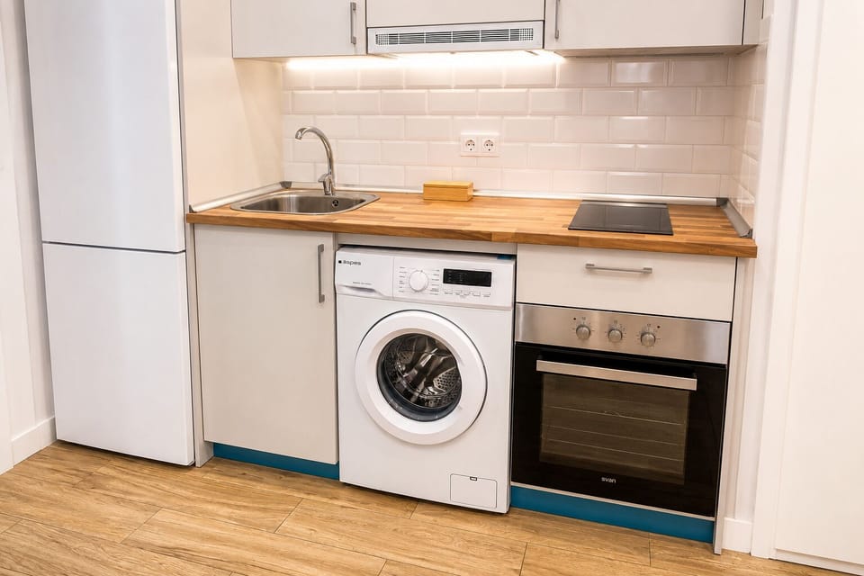 Classic Apartment | Private kitchen | Toaster, cleaning supplies