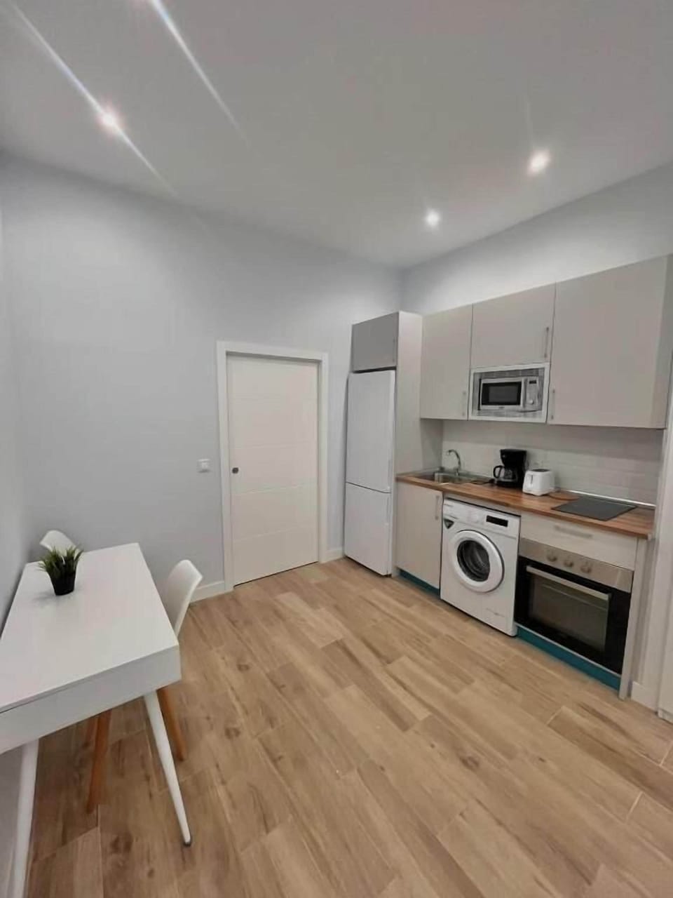 Classic Apartment | Private kitchen | Toaster, cleaning supplies