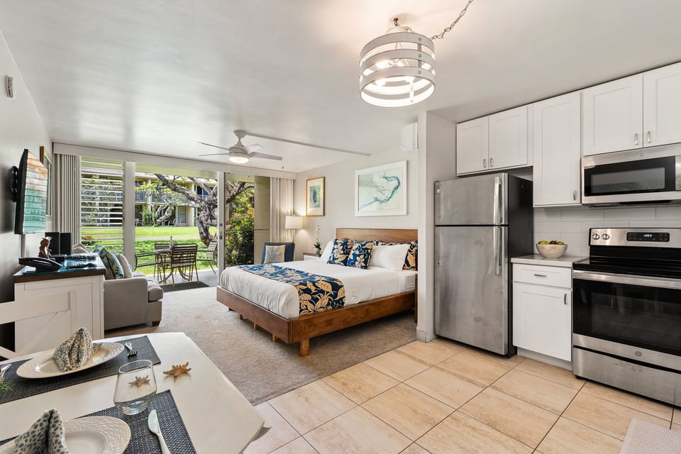 Fully equipped kitchen that opens to the bedroom and lanai, creating a bright, connected living space.
