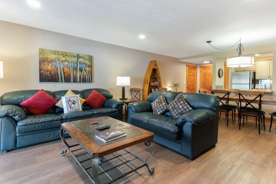 Cozy living area with fireplace and walkout balcony- main condo