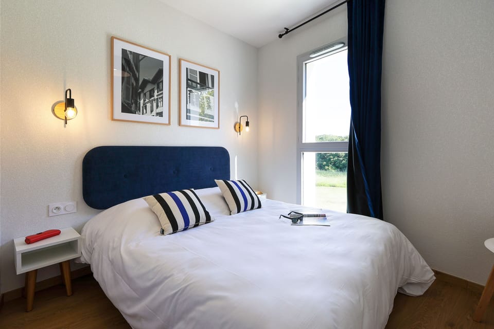 The comfortable double bedroom offers a peaceful retreat for the adults in the group, with quality bedding and natural light to start each morning refreshed.