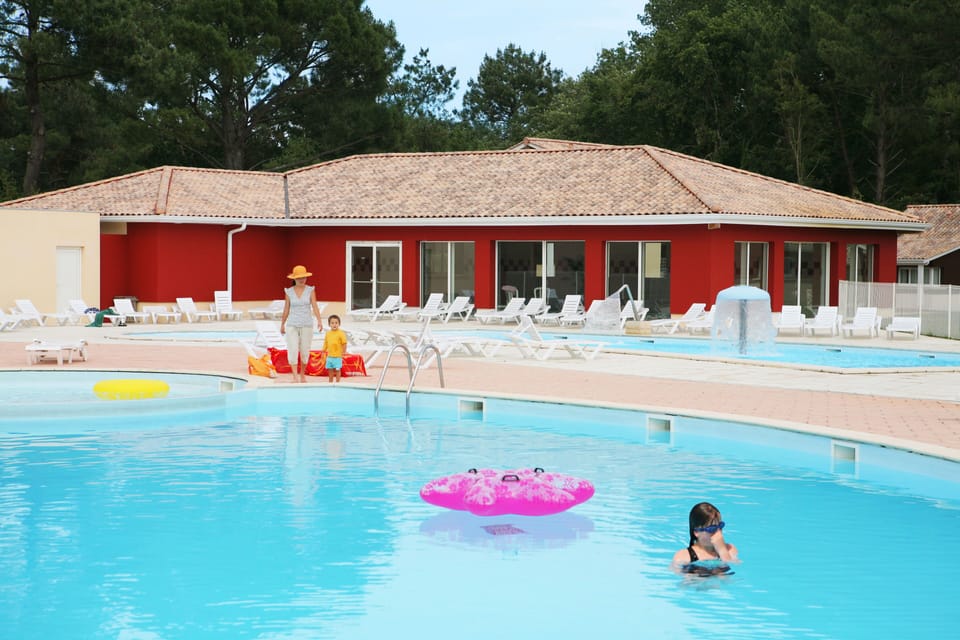 The main outdoor pool sits at the heart of the resort's pedestrian-only wooded estate, surrounded by the residence's charming pine-clad accommodation.