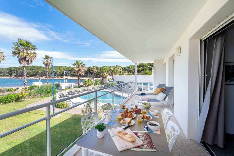 Spacious private terrace overlooking the heated outdoor pool and the Mediterranean — your own front-row seat to the best of Saint-Mandrier.