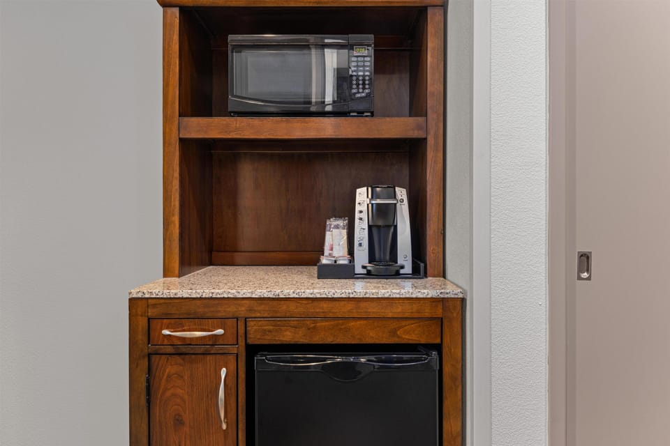 Desk, laptop workspace, blackout drapes, iron/ironing board