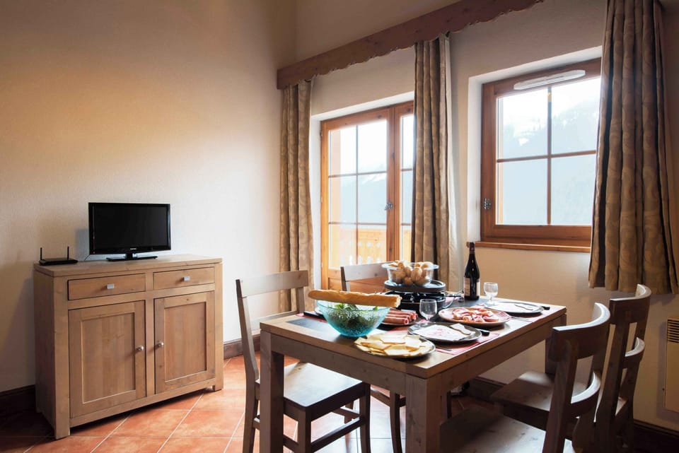 A fully equipped kitchenette and dining area, ready for self-catered stays whether you're fuelling up for a ski day or a summer hike.