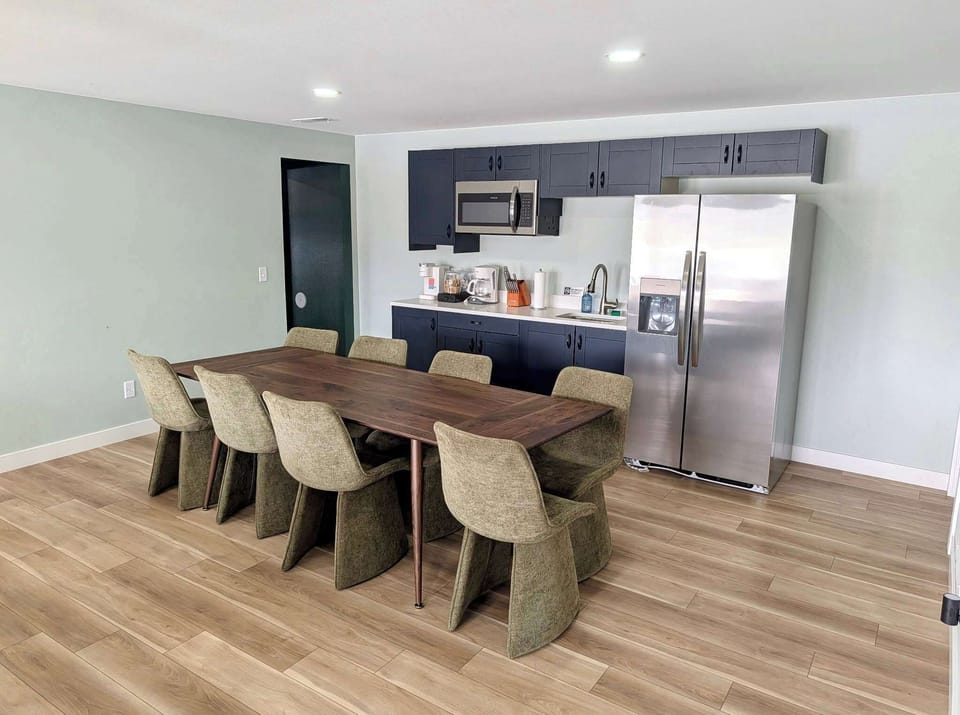 The kitchenette is located on the lower level in the open concept layout with the dining area and #2 living room.
