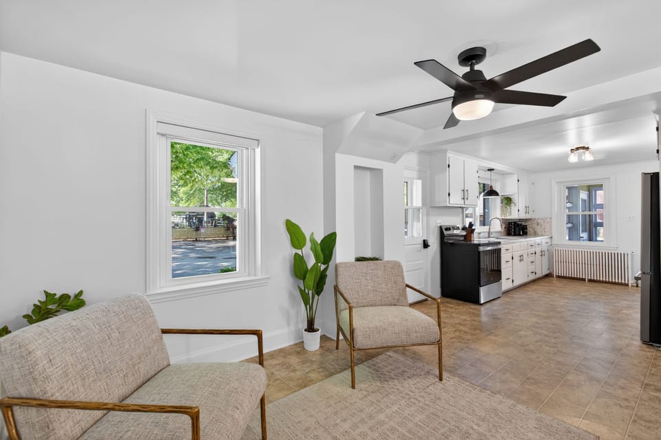 Bright open living space with modern kitchen and abundant natural light