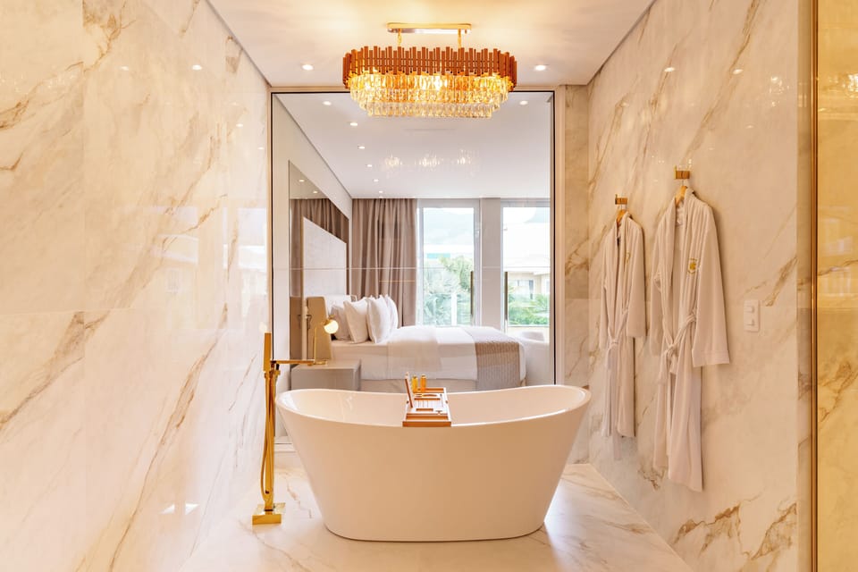 Romantic Suite, Bathtub, Resort View | Bathroom | Hair dryer, towels