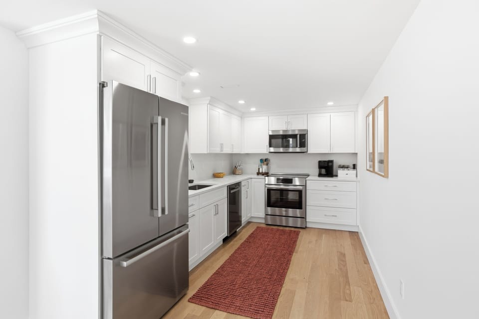 Brew your morning espresso or whip up a gourmet dinner in this sunlit space.
