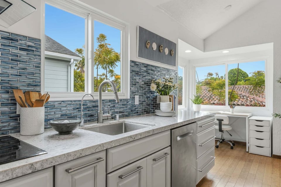 The galley kitchen and corner desk space