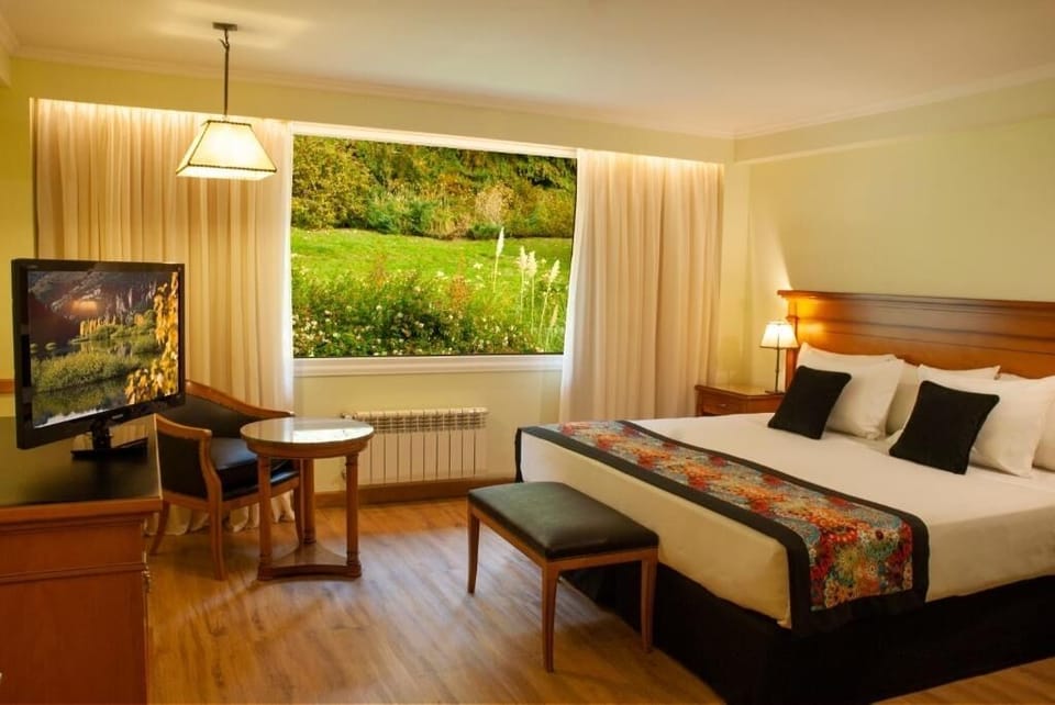 Unwind in a warm room with garden views and workspace.