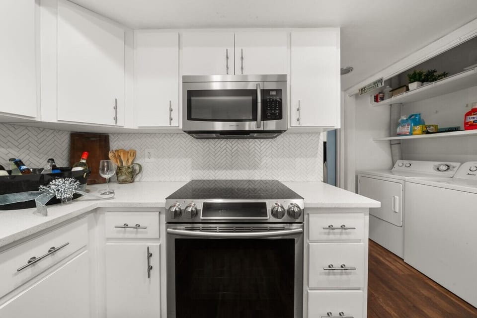 Kitchen | Electric Range & Over-Range Microwave | Laundry Area