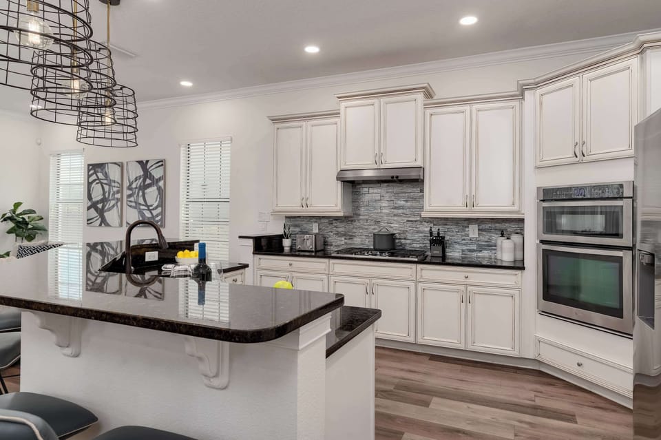 Modern kitchen with granite countertops and vintage-style cabinetry