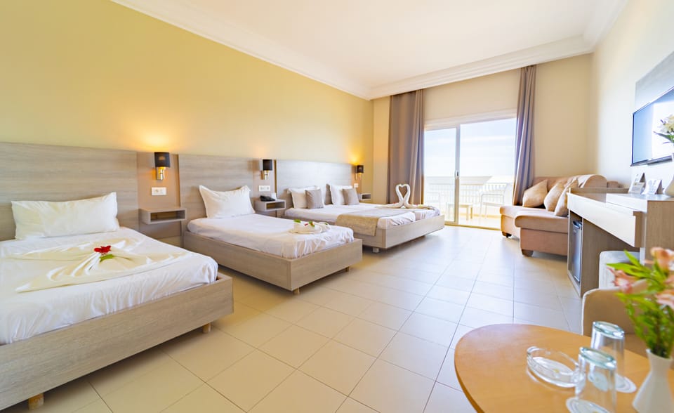 Standard Triple Room, City View | Minibar, in-room safe, blackout drapes, WiFi (free)