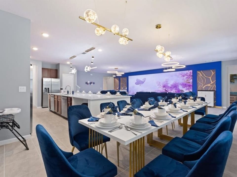 Large living room, dining, and kitchen area with plenty of seating to host your entire group.