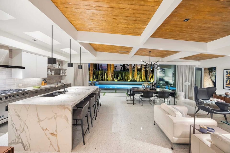 Seamless indoor–outdoor flow showcasing the open living areas connected directly to the pool.