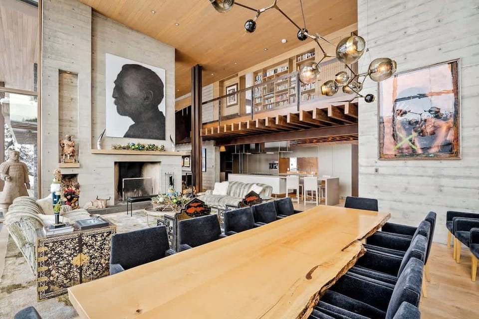 Living room, and dinning room area. Wood burning fireplace.