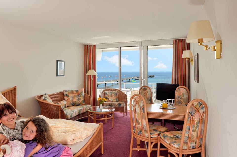 Junior Suite, Sea View | Living area | Flat-screen TV
