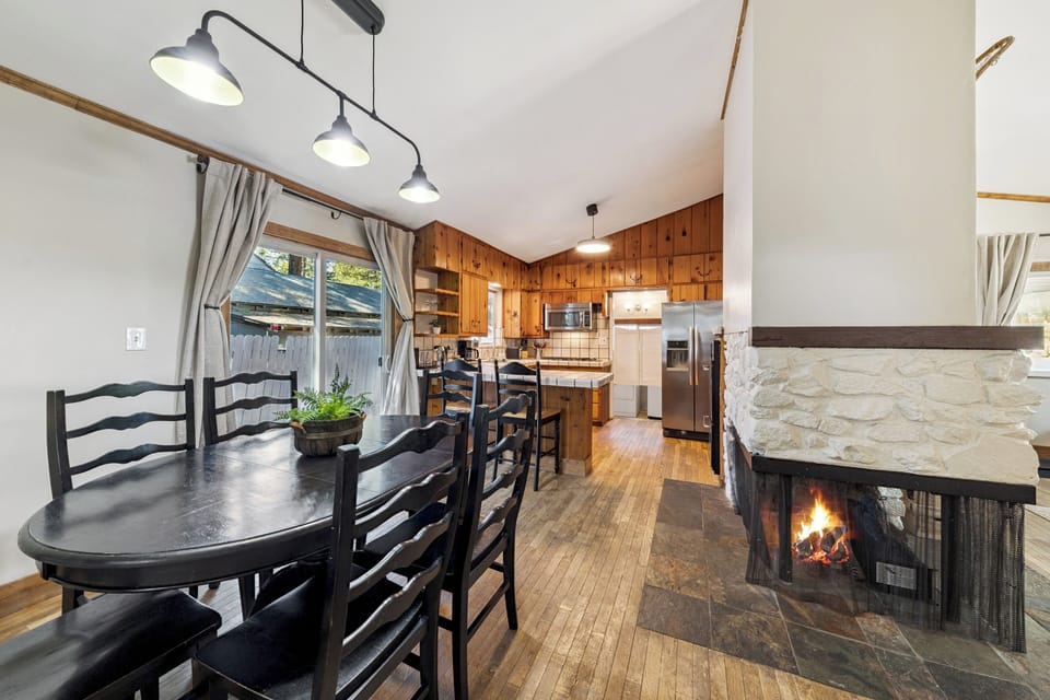 Gather around the dining table with electric fire place beside you, or step into the fully-equipped kitchen ready for your home-cooked meals.