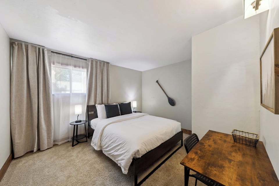 Step into your peaceful retreat where soft natural light filters through, illuminating crisp linens on a plush bed. Modern touches blend with cozy warmth, creating your perfect getaway sanctuary.