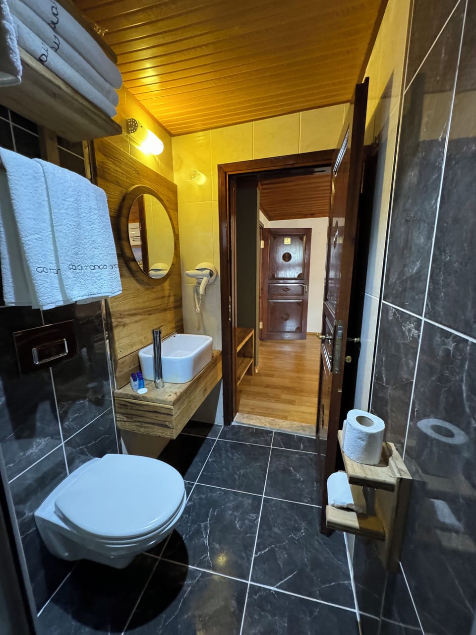 Shower, free toiletries, hair dryer, slippers