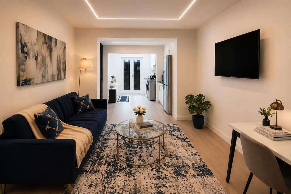 Contemporary studio with smart lighting and modern furnishings — self check-in via lockbox for a seamless arrival