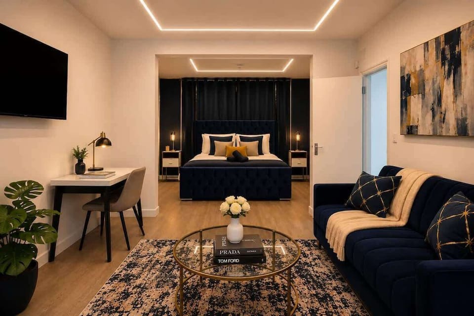 Stylish open-plan living area with Smart TV, smart lighting and a comfortable sofa bed — your base for exploring London