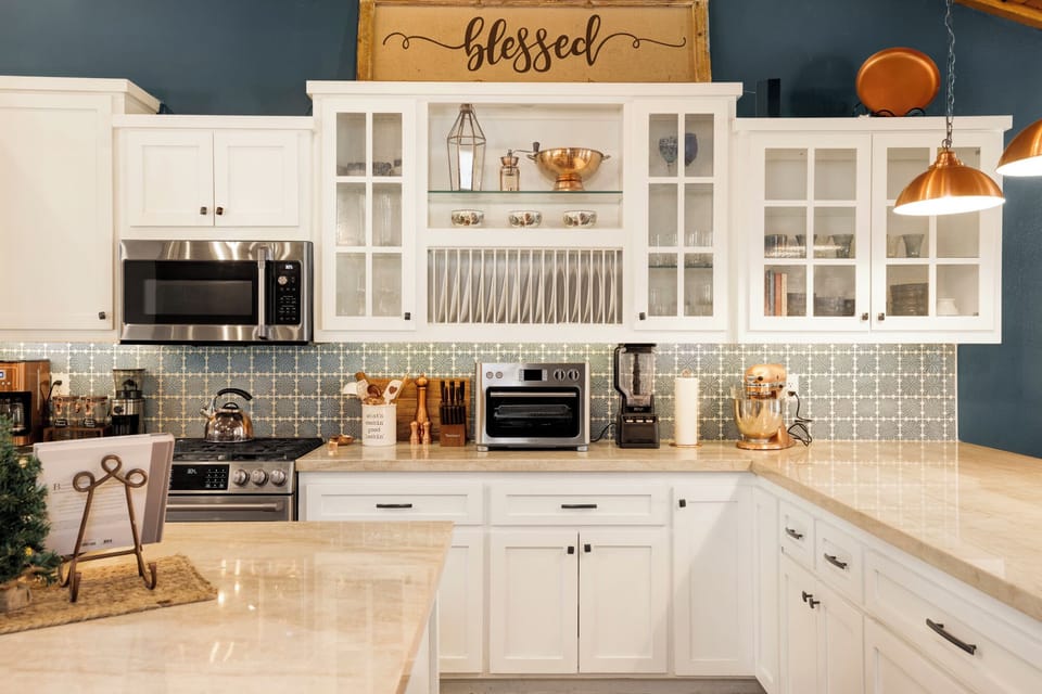 Fully equipped cabin kitchen with ample cabinetry, stove, fridge, and coffee maker—perfect for cooking meals, morning coffee, and feeling right at home on your stay.