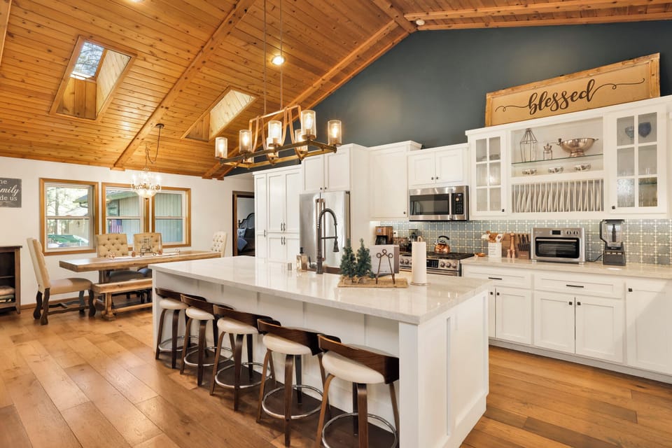 Fully equipped cabin kitchen with ample cabinetry, stove, fridge, and coffee maker—perfect for cooking meals, morning coffee, and feeling right at home on your stay.