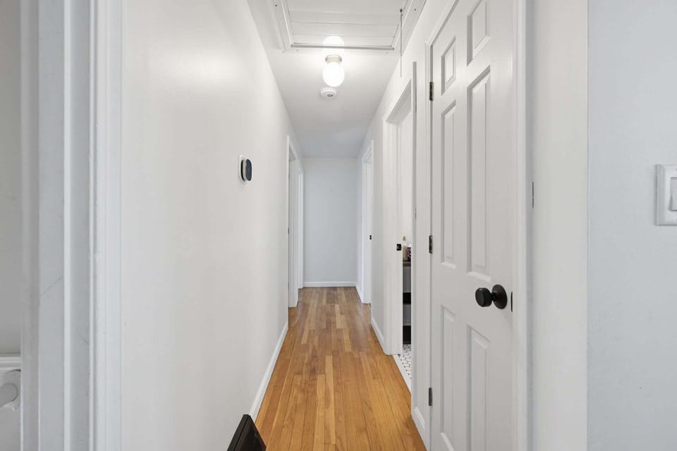 Hallway leading to sleeping accommodations and bathroom