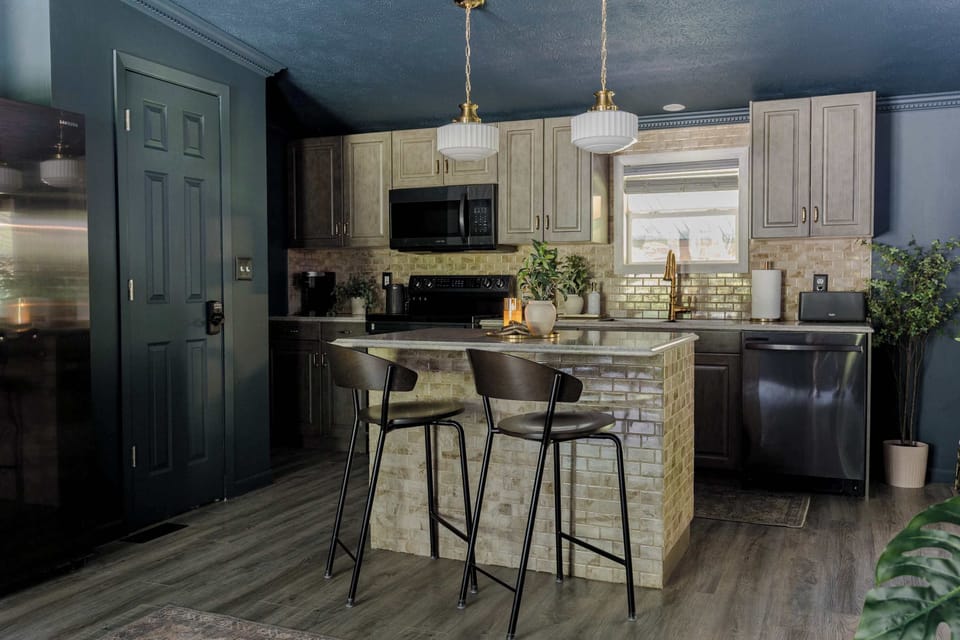 Fully stocked kitchen with refrigerator, dishwasher, stove, microwave, and more!