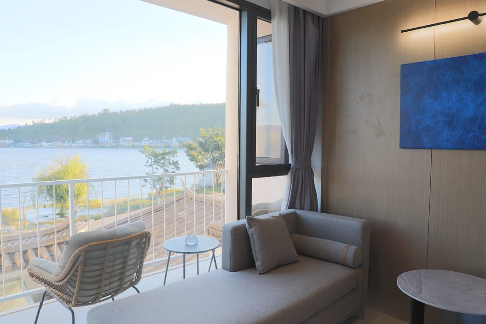 Panoramic Twin Room, Lake View | Living area | 55-inch LCD TV with cable channels