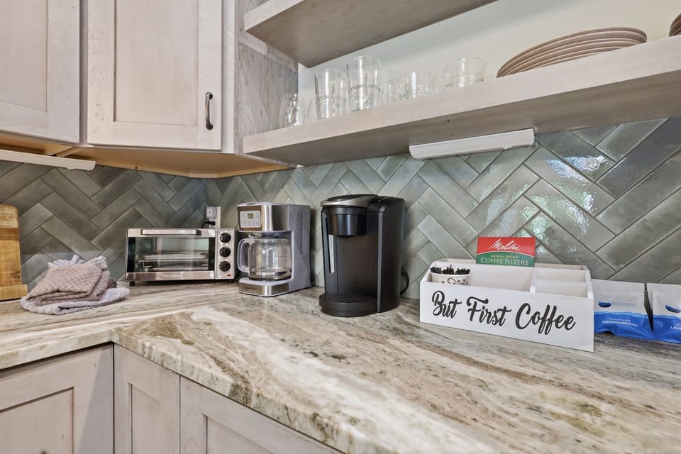 Stylish kitchen coffee bar featuring granite counters and dual coffee makers — the perfect setup for starting every mountain morning off right.