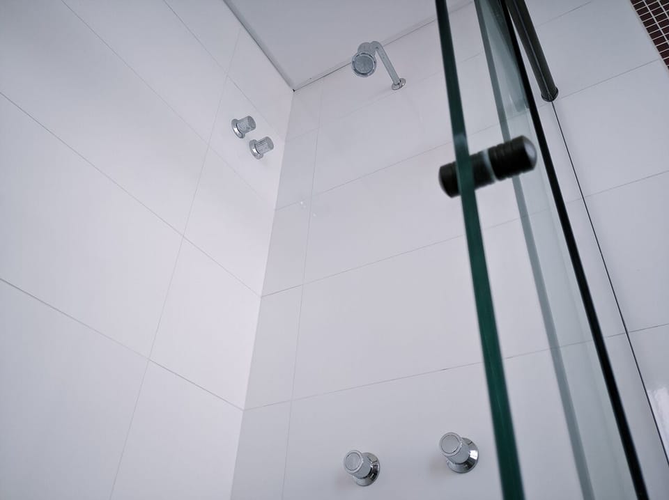 Shower, rainfall showerhead, towels, soap