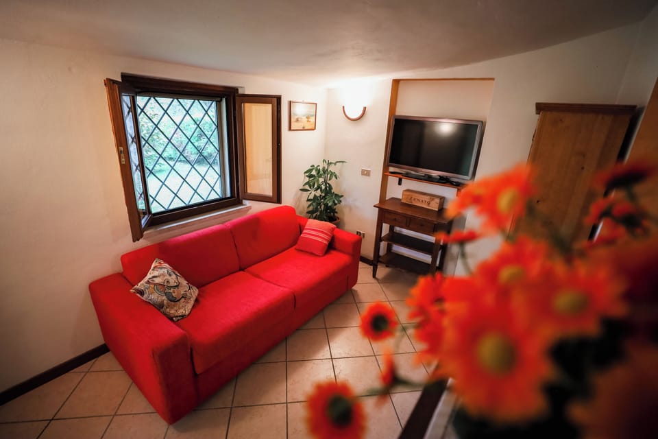 Villa, Garden View | Living area | Flat-screen TV