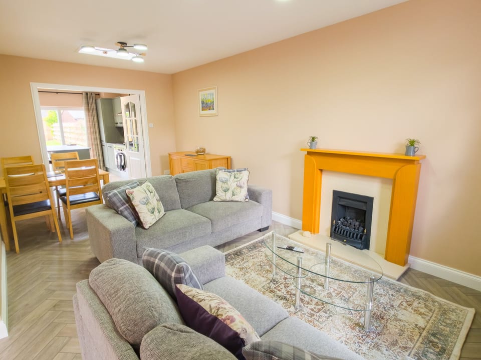 Sink into the plush sofas and unwind after a day exploring the beautiful Scottish Highlands. This welcoming lounge features a cosy fireplace and plenty of seating, making it the perfect place for the whole family to come together.