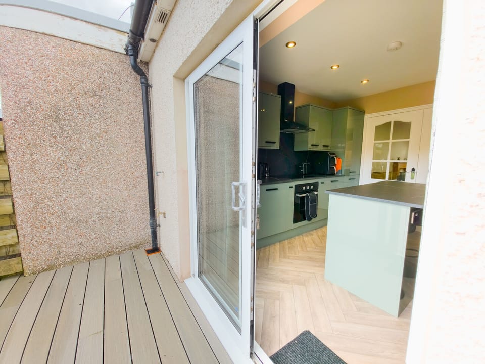 Step outside onto the private decking and soak up the fresh Scottish air. This sun-catching outdoor space is ideal for morning coffee or relaxing after a day exploring Inverness.