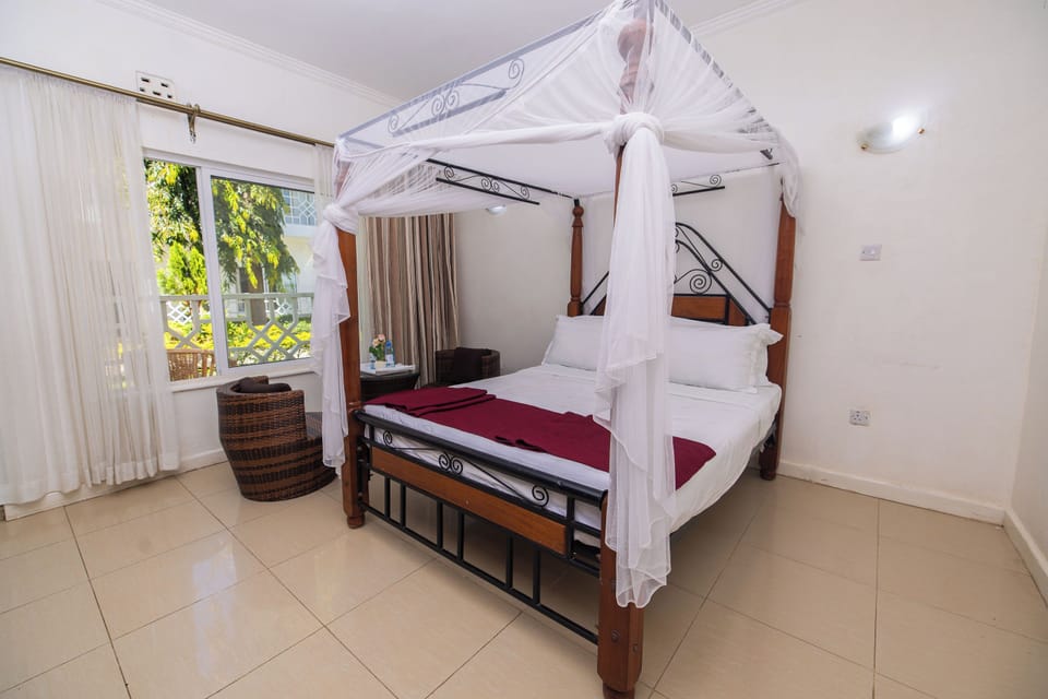 Standard Double Room, Garden View | Blackout drapes, iron/ironing board, free WiFi