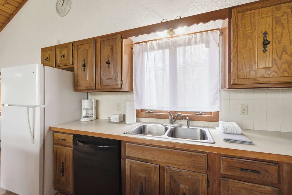 Natural light and warm wood cabinetry create an inviting space for morning coffee.