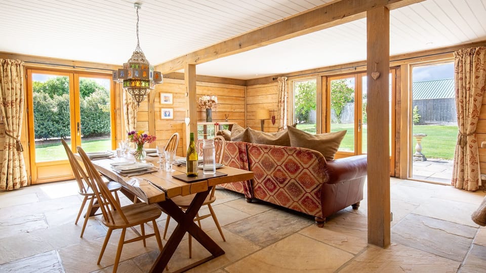 This open-plan space features French patio doors leading outside.