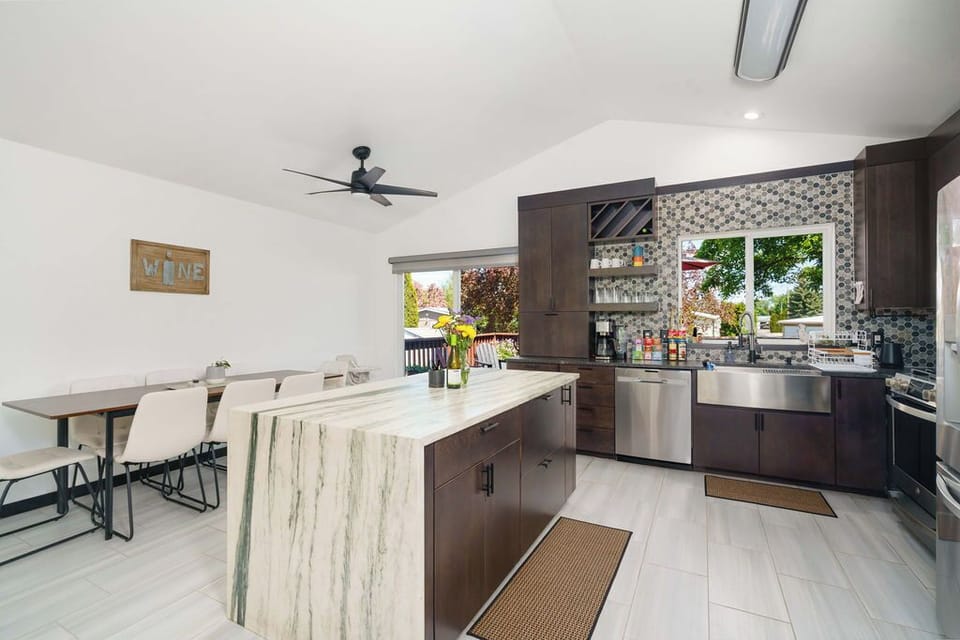 Fully stocked kitchen with dining table.